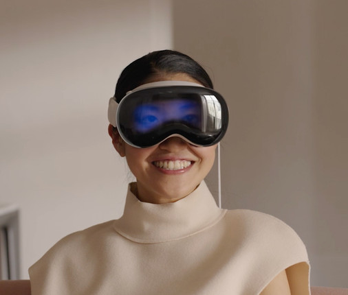 asian lady smiling while wearing apple vision pro headset